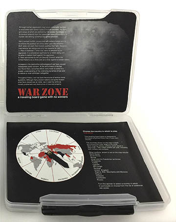 War Zone
WarZone: a traveling board game with no winner" is designed to be played anywhere other than in your own country. Instructions, game board, spinner board and game pieces are housed in a clear plastic suitcase. In the top of the suitcase, an image of the first atomic bomb blast is overlaid with a definition of war as “armed conflict, prosecuted with military forces aiming to enforce the political will of the victor upon the defeated”. It also contains information about human aggression from prehistory to the present and questions whether war is noble or morally problematic and destructive of lives and property. The Spinner Board, printed onto stiff board and contour cut to fit into in the bottom of the suitcase, allows you to choose the country in which to play and gives information on ongoing conflicts around the world. The countries shown on the map in black and around the outer edge of the circle have ongoing military conflicts that result in more than 1,000 violent deaths per year, including both military and civilians. Other conflicts are shown in red on the map. You can turn the spinner to select a country in which to participate or choose from the list of additional war zones. The Rules of Engagement state that you can place your soldier on any square of the game board and move randomly any number of spaces in any direction. You need not take turns and can remove the soldiers of any other player at will, unless you are removed first. If you are on a square with information and instructions, do as you are told. The Game Board resembles a checkerboard with squares which give instructions such as “no weapons found: look again”, “tour of duty extended: start over” and “peace negotiations begun: pray for success”. The red and black checker-like pieces are “us” and “them”. The game never ends, but may move to a different place of engagement. There are no winners, only losers. The WarZone game boards and suitcase were printed at Roland DGA on the LEF-300. a flatbed printer with white and gloss inks. It is an edition of ten in a suitcase 10 3/8” x 12 7/8” x 1 ½”.