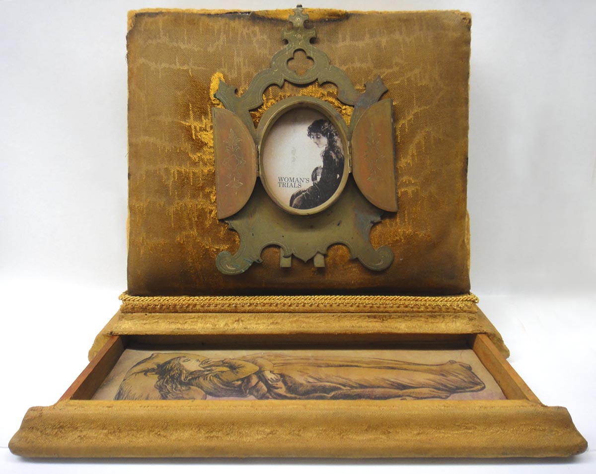 Woman's TrialsAn altered Victorian book placed within a vintage box. 11" z 12" x 2"